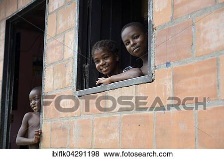 Three children, portraits, afro-columbian village of El Salto on the River Rio Andagueda, Choco Department, Colombia, South America View Large Photo Image Stock Photo - Three children, portraits, afro-columbian village of El Salto on the River Rio Andagueda, Choco Department, Colombia, South America. Fotosearch