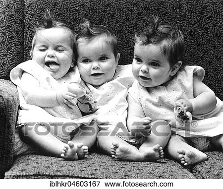 Three little girls sitting in an armchair, England, Great Britain View Large Photo Image Stock Photo - Three little girls sitting in an armchair, England, Great Britain. Fotosearch