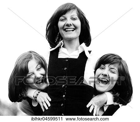 Stock Image - Three women have fun, England, Great Britain. Fotosearch