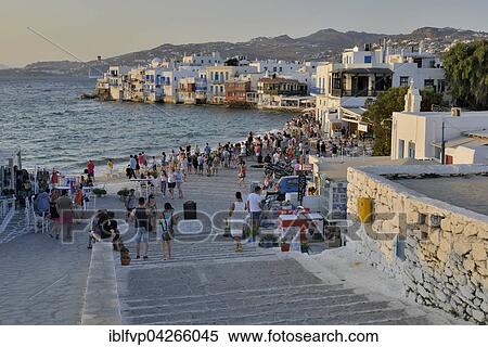 Tourists watching the sunset in Little Venice, Chora or Mykonos Town, Mykonos, Cyclades, Greece, Europe View Large Photo Image Stock Photography - Tourists watching the sunset in Little Venice, Chora or Mykonos Town, Mykonos, Cyclades, Greece, Europe. Fotosearch