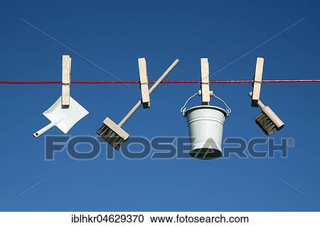 Stock Image - Toy cleaning utensils on a leash, Berlin, Germany, Europe. Fotosearch