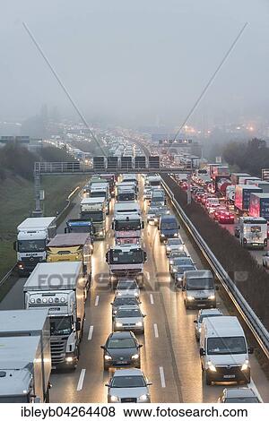 Traffic jam on the A8 in fog, near Stuttgart, Baden-Wurttemberg, Germany, Europe View Large Photo Image Stock Photo - Traffic jam on the A8 in fog, near Stuttgart, Baden-Wurttemberg, Germany, Europe. Fotosearch