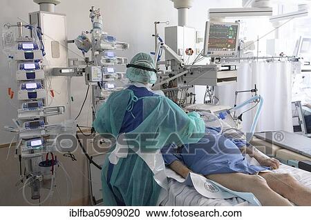Stock Image - Treatment of a patient in intensive care unit for Covid patients, Agatharied Hospital, Agatharied, Bavaria, Germany, Europe. Fotosearch