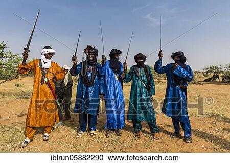 Tuaregs with their swords, Gerewol festival, courtship ritual competition among the Woodaabe Fula people, Niger, Africa View Large Photo Image Stock Image - Tuaregs with their swords, Gerewol festival, courtship ritual competition among the Woodaabe Fula people, Niger, Africa. Fotosearch