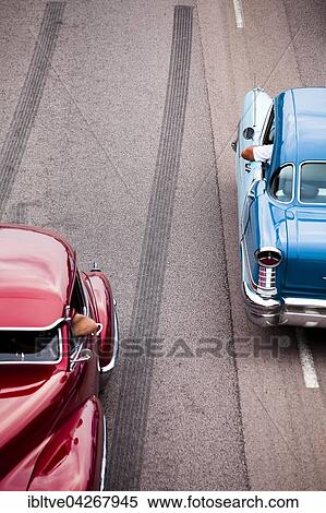 Two American classic cars on the road, Power Meet oldtimer meeting, Vasteras, Vastmanland, Sweden, Europe View Large Photo Image Stock Photography - Two American classic cars on the road, Power Meet oldtimer meeting, Vasteras, Vastmanland, Sweden, Europe. Fotosearch