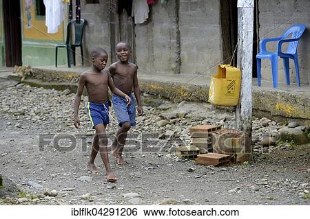 Two boys, afro-columbian village of El Salto on the River Rio Andagueda, Choco Department, Colombia, South America View Large Photo Image Stock Photograph - Two boys, afro-columbian village of El Salto on the River Rio Andagueda, Choco Department, Colombia, South America. Fotosearch