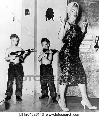 Two boys with rifles against mother, ca. 1950, exact place unknown, Cuba, Caribbean, Central America View Large Photo Image Stock Image - Two boys with rifles against mother, ca. 1950, exact place unknown, Cuba, Caribbean, Central America. Fotosearch