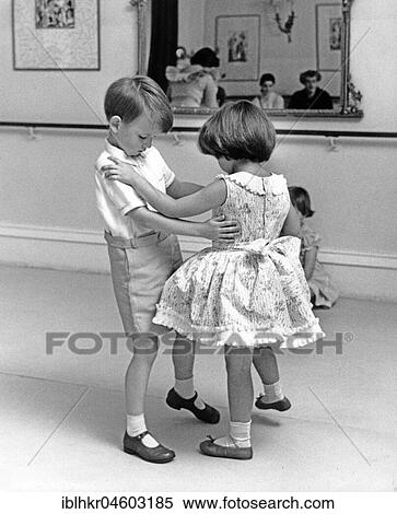 Stock Photography - Two children dancing, girl and boy, England, Great Britain. Fotosearch