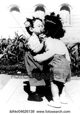 Two children kiss each other, ca. 1950, exact place unknown, Cuba, Caribbean, Central America View Large Photo Image Stock Photo - Two children kiss each other, ca. 1950, exact place unknown, Cuba, Caribbean, Central America. Fotosearch