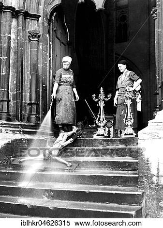 Two cleaning ladies spray crucifix with Jesus, ca. 1920, around Leipzig, Germany, Europe View Large Photo Image Stock Photography - Two cleaning ladies spray crucifix with Jesus, ca. 1920, around Leipzig, Germany, Europe. Fotosearch