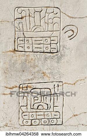 Stock Photo - Two hieroglyphs on marble stele at Plaza de la Estela, Ruins of Xochicalco, Cuernavaca, Morelos, Mexico, North America. Fotosearch