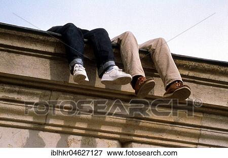 Two pair of legs on a wall, Berlin, Germany, Europe View Large Photo Image Stock Photo - Two pair of legs on a wall, Berlin, Germany, Europe. Fotosearch