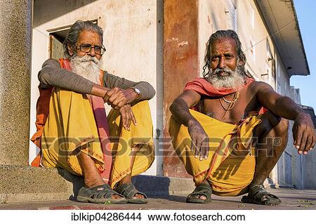 Picture - Two Sadhus sitting on the ground, holy men, Galtaji, Khania-Balaji, Jaipur, Rajasthan, India, Asia. Fotosearch