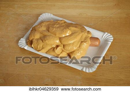Viennese sausages under a lot of mustard View Large Photo Image Stock Photo - Viennese sausages under a lot of mustard. Fotosearch
