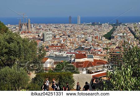 View from the Parc Guell towards the city, with Sagrada Familia, Mediterranean Sea behind, Barcelona, Catalonia, Spain, Europe View Large Photo Image Stock Image - View from the Parc Guell towards the city, with Sagrada Familia, Mediterranean Sea behind, Barcelona, Catalonia, Spain, Europe. Fotosearch