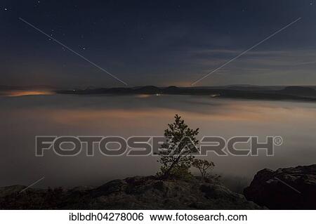 Stock Photograph - View of clouds in Elbe Valley from Lilienstein, Saxon Switzerland National Park, Konigstein, Germany, Europe. Fotosearch