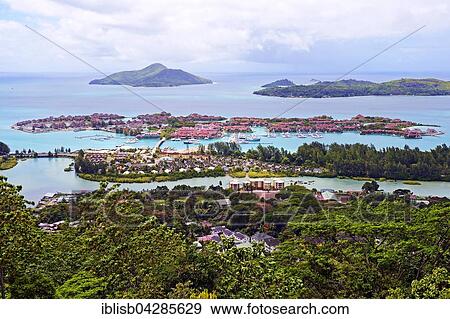 View of the luxury artificial island Eden Island, in front of the island of Mahe, Seychelles, Africa View Large Photo Image Stock Photo - View of the luxury artificial island Eden Island, in front of the island of Mahe, Seychelles, Africa. Fotosearch