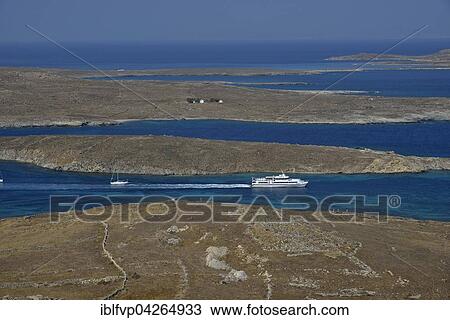 View over the island of Delos with an excursion boat, Cyclades, Greece, Europe View Large Photo Image Stock Image - View over the island of Delos with an excursion boat, Cyclades, Greece, Europe. Fotosearch