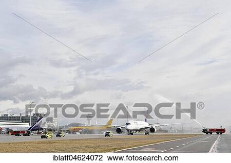 Stock Image - Water christening, maiden flight, Lufthansa Airbus A 350-900, Munich Airport, Upper Bavaria, Germany, Europe. Fotosearch