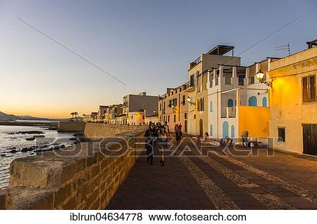 Waterfront in the coastal town of Alghero after sunset, Sardinia, Italy, Europe View Large Photo Image Stock Photo - Waterfront in the coastal town of Alghero after sunset, Sardinia, Italy, Europe. Fotosearch