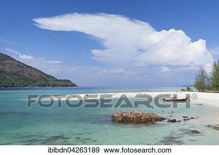 Stock Photo - White strip of sand, part of Sunrise Beach, on Ko Lipe or Koh Lipe island, Tarutao National Marine Park, Thailand, Asia. Fotosearch