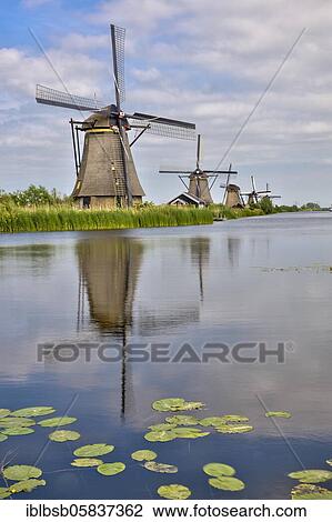 Windmills with water reflection, Kinderdijk, Netherlands View Large Photo Image Stock Image - Windmills with water reflection, Kinderdijk, Netherlands. Fotosearch