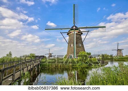 Windmills with water reflection, Kinderdijk, Netherlands View Large Photo Image Stock Photograph - Windmills with water reflection, Kinderdijk, Netherlands. Fotosearch