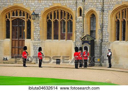 Windsor Castle in the small town of Windsor near London, one of the three official residences of the Queen of England, scene with the royal guards, the Queen's Guard. View Large Photo Image Picture - Windsor Castle in the small town of Windsor near London, one of the three official residences of the Queen of England, scene with the royal guards, the Queen's Guard.. Fotosearch