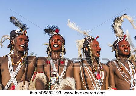 Wodaabe-Bororo men with faces painted at the annual Gerewol festival, courtship ritual competition among the Woodaabe Fula people, Niger, Africa View Large Photo Image Stock Image - Wodaabe-Bororo men with faces painted at the annual Gerewol festival, courtship ritual competition among the Woodaabe Fula people, Niger, Africa. Fotosearch
