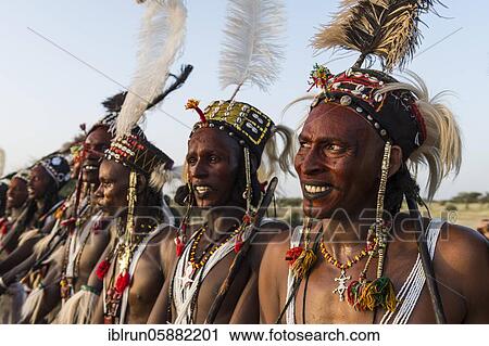Wodaabe-Bororo men with faces painted at the annual Gerewol festival, courtship ritual competition among the Woodaabe Fula people, Niger, Africa View Large Photo Image Stock Image - Wodaabe-Bororo men with faces painted at the annual Gerewol festival, courtship ritual competition among the Woodaabe Fula people, Niger, Africa. Fotosearch
