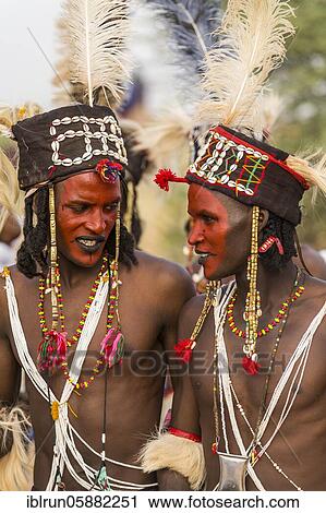 Wodaabe-Bororo men with faces painted at the annual Gerewol festival, courtship ritual competition among the Woodaabe Fula people, Niger, Africa View Large Photo Image Stock Image - Wodaabe-Bororo men with faces painted at the annual Gerewol festival, courtship ritual competition among the Woodaabe Fula people, Niger, Africa. Fotosearch