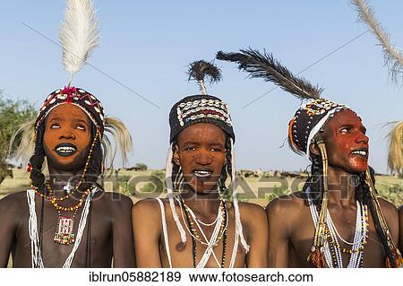 Wodaabe-Bororo men with faces painted at the annual Gerewol festival, courtship ritual competition among the Woodaabe Fula people, Niger, Africa View Large Photo Image Stock Photo - Wodaabe-Bororo men with faces painted at the annual Gerewol festival, courtship ritual competition among the Woodaabe Fula people, Niger, Africa. Fotosearch