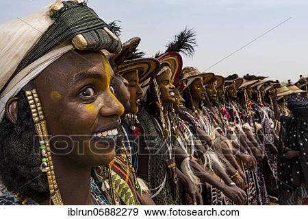 Stock Photo - Wodaabe-Bororo men with faces painted at the annual Gerewol festival, courtship ritual competition among the Woodaabe Fula people, Niger, Africa. Fotosearch