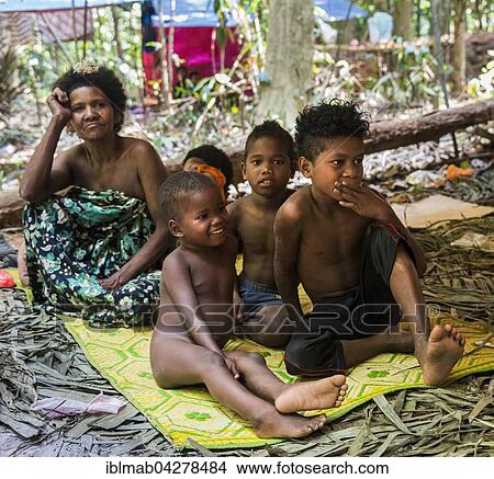 Woman and children, aboriginal Orang Asil, sitting on the ground in the jungle, indigenous people, tropical rainforest, Taman Negara, Malaysia, Asia View Large Photo Image Picture - Woman and children, aboriginal Orang Asil, sitting on the ground in the jungle, indigenous people, tropical rainforest, Taman Negara, Malaysia, Asia. Fotosearch