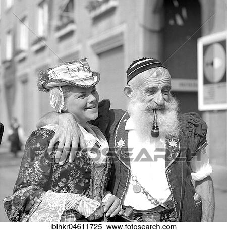 Woman and man dressed in traditional costumes, fair, around 1950, Freiburg, Germany, Europe View Large Photo Image Stock Photography - Woman and man dressed in traditional costumes, fair, around 1950, Freiburg, Germany, Europe. Fotosearch
