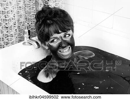 Woman bathing in mud, England, Great Britain View Large Photo Image Stock Image - Woman bathing in mud, England, Great Britain. Fotosearch