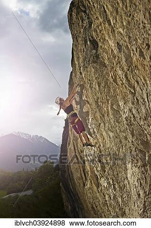 Woman climbing, lead climbing, on a rock face, Martinswand, Zirl, Tyrol, Austria, Europe View Large Photo Image Stock Photo - Woman climbing, lead climbing, on a rock face, Martinswand, Zirl, Tyrol, Austria, Europe. Fotosearch