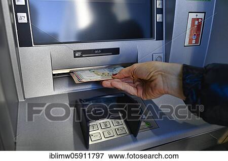 Woman draws 100 EURO cash at the cash machine of a savings bank, Waiblingen, Baden-Württemberg, Germany, Europe View Large Photo Image Stock Photo - Woman draws 100 EURO cash at the cash machine of a savings bank, Waiblingen, Baden-Württemberg, Germany, Europe. Fotosearch