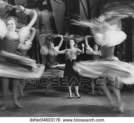Stock Photograph - Woman giving lessons to female dancers, England, Great Britain. Fotosearch