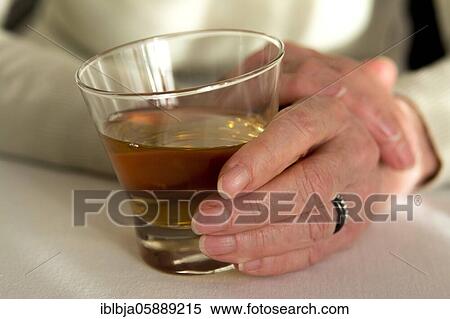 Woman hand holding glass of whiskey, France, Europe View Large Photo Image Stock Photography - Woman hand holding glass of whiskey, France, Europe. Fotosearch