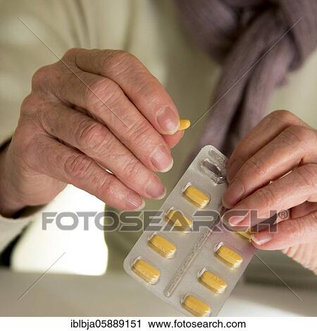 Woman holding medication pill, France, Europe View Large Photo Image Stock Image - Woman holding medication pill, France, Europe. Fotosearch