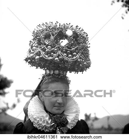 Woman in traditional traditional costume with large hat, ca. 1955, Black Forest, Germany, Europe View Large Photo Image Stock Image - Woman in traditional traditional costume with large hat, ca. 1955, Black Forest, Germany, Europe. Fotosearch
