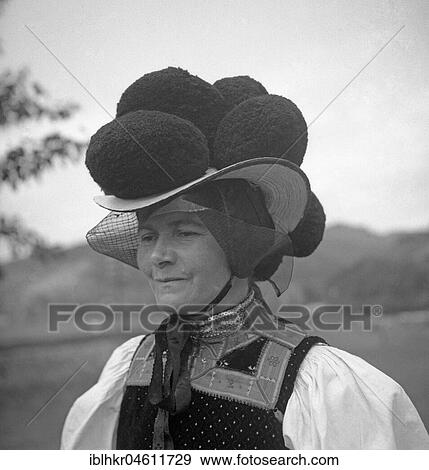 Stock Photo - Woman in traditional traditional costume with hat, celebration, around 1950, surroundings of Freiburg, Germany, Europe. Fotosearch