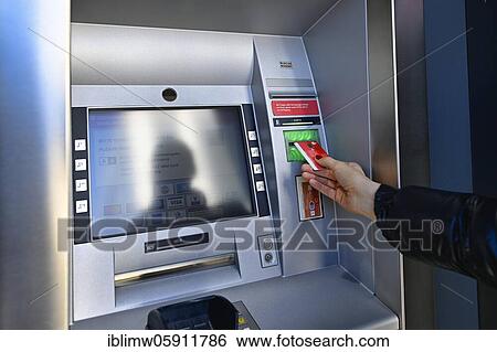 Woman introduces ec-card at the cash dispenser of a savings bank, Waiblingen, Baden-Württemberg, Germany, Europe View Large Photo Image Stock Photograph - Woman introduces ec-card at the cash dispenser of a savings bank, Waiblingen, Baden-Württemberg, Germany, Europe. Fotosearch