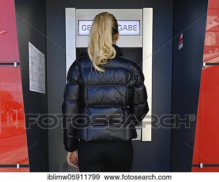 Woman standing in front of an ATM at a savings bank, Waiblingen, Baden-Württemberg, Germany, Europe View Large Photo Image Stock Photo - Woman standing in front of an ATM at a savings bank, Waiblingen, Baden-Württemberg, Germany, Europe. Fotosearch