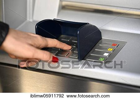Woman typing in secret code at the cash machine of a savings bank, Waiblingen, Baden-Württemberg, Germany, Europe View Large Photo Image Stock Image - Woman typing in secret code at the cash machine of a savings bank, Waiblingen, Baden-Württemberg, Germany, Europe. Fotosearch