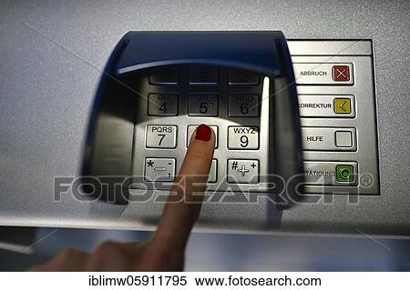 Woman typing in secret code at the cash machine of a savings bank, Waiblingen, Baden-Württemberg, Germany, Europe View Large Photo Image Stock Photography - Woman typing in secret code at the cash machine of a savings bank, Waiblingen, Baden-Württemberg, Germany, Europe. Fotosearch