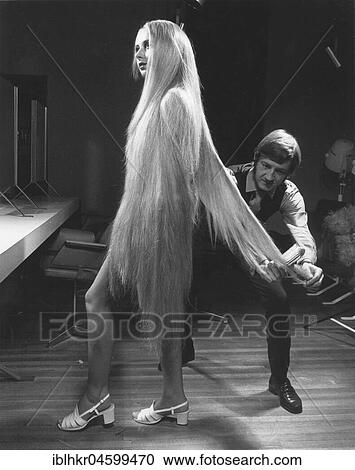Woman with extremely long blonde hair, England, Great Britain View Large Photo Image Stock Image - Woman with extremely long blonde hair, England, Great Britain. Fotosearch