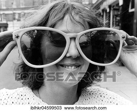 Woman with large glasses, England, Great Britain View Large Photo Image Stock Image - Woman with large glasses, England, Great Britain. Fotosearch