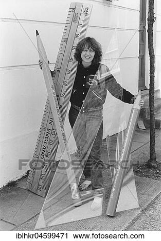 Stock Image - Woman with large rulers and pins, England, Great Britain. Fotosearch